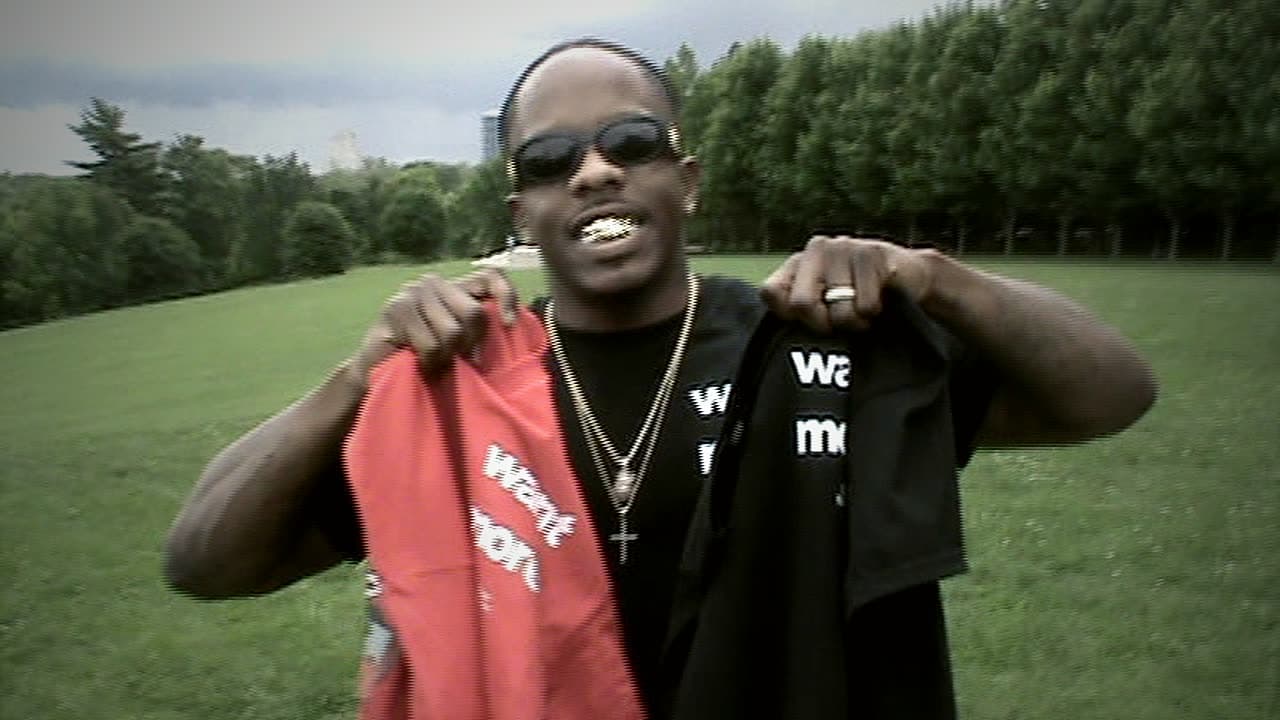 Amp Trop holding the red AMP hoodie and the black “want more” tee